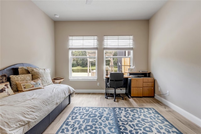 bedroom with light hardwood / wood-style floors