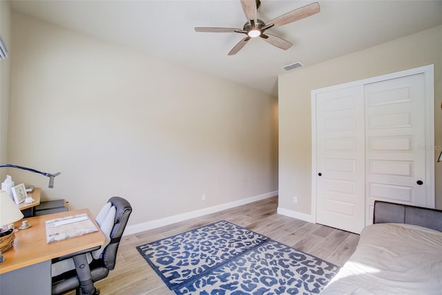 office featuring ceiling fan and light wood-type flooring