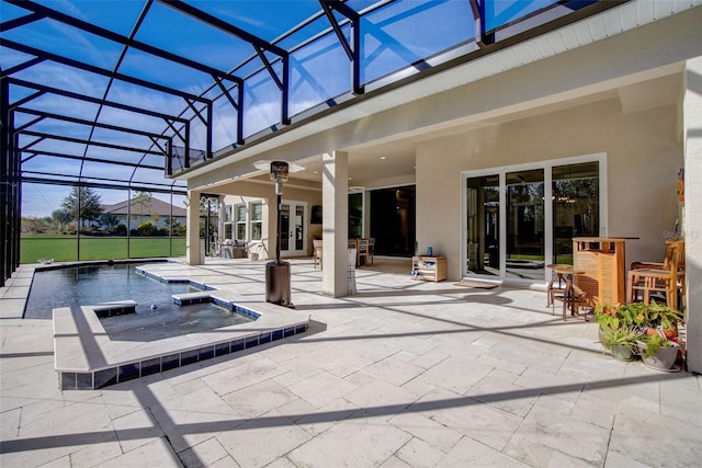 view of patio featuring a pool with hot tub and a lanai