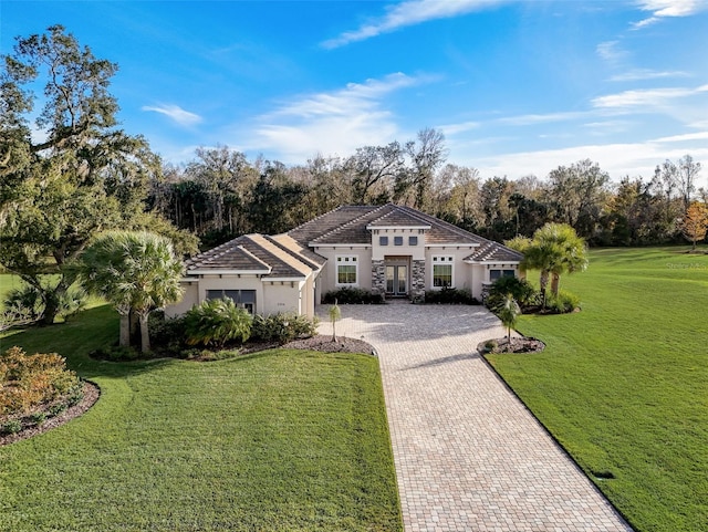 mediterranean / spanish-style house featuring a front yard