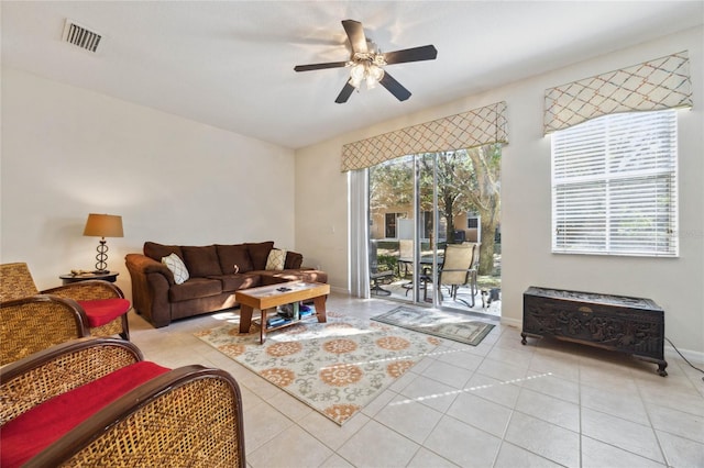 living room featuring ceiling fan and light tile patterned floors