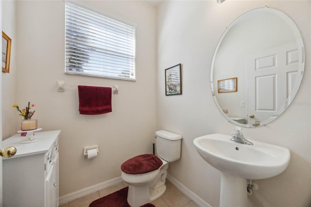 bathroom featuring tile patterned flooring and toilet