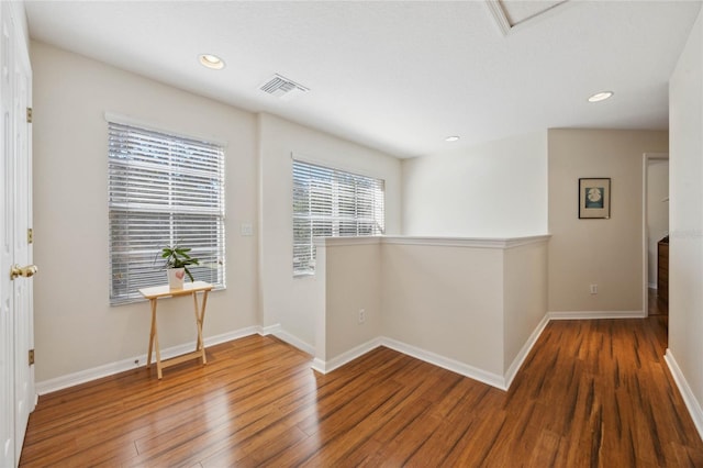 corridor featuring hardwood / wood-style floors