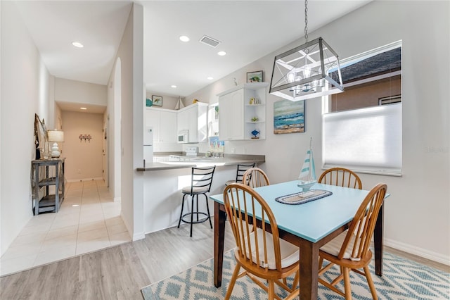 dining room with light hardwood / wood-style floors