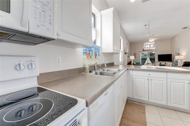 kitchen with white cabinetry, sink, ceiling fan, light tile patterned floors, and white appliances