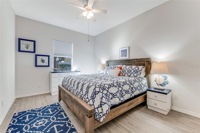 bedroom with light hardwood / wood-style floors and ceiling fan