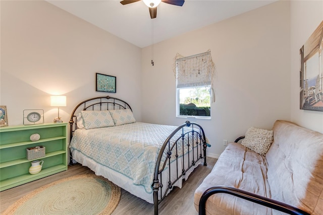 bedroom with hardwood / wood-style flooring and ceiling fan