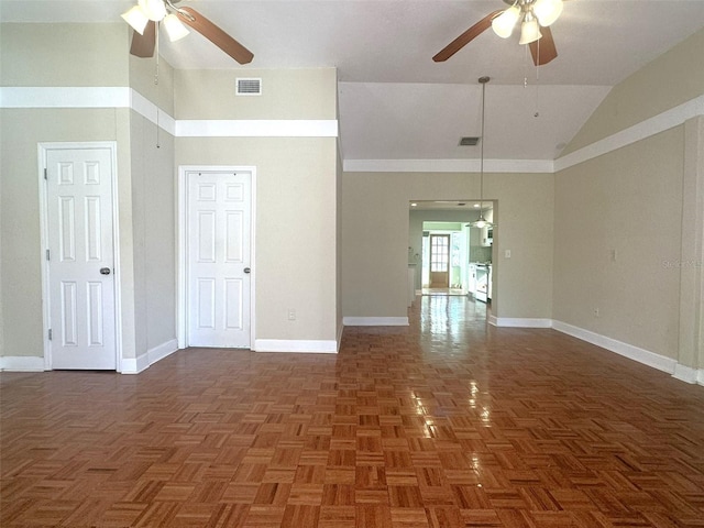 empty room featuring dark parquet flooring, ceiling fan, and high vaulted ceiling