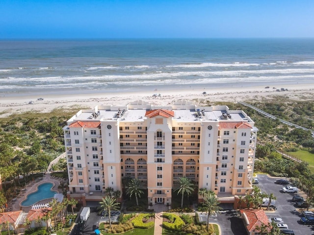 bird's eye view with a water view and a view of the beach