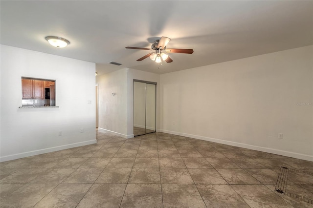 empty room featuring ceiling fan