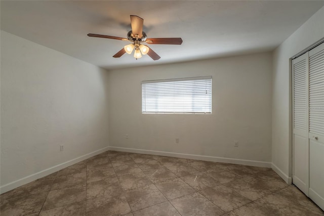 unfurnished bedroom with a closet and ceiling fan