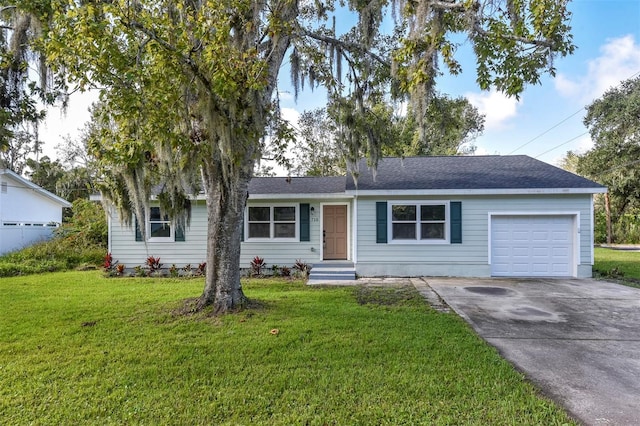 single story home featuring a garage and a front yard