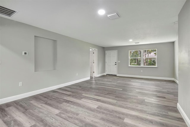 spare room featuring hardwood / wood-style floors