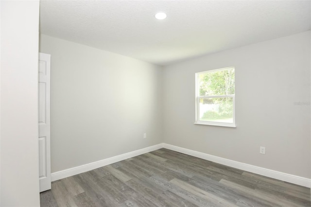 spare room featuring hardwood / wood-style flooring