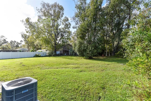 view of yard featuring central air condition unit