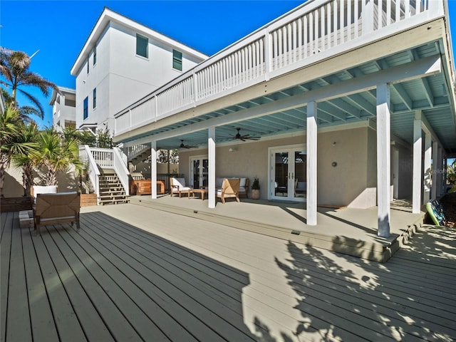 deck featuring outdoor lounge area, ceiling fan, and french doors