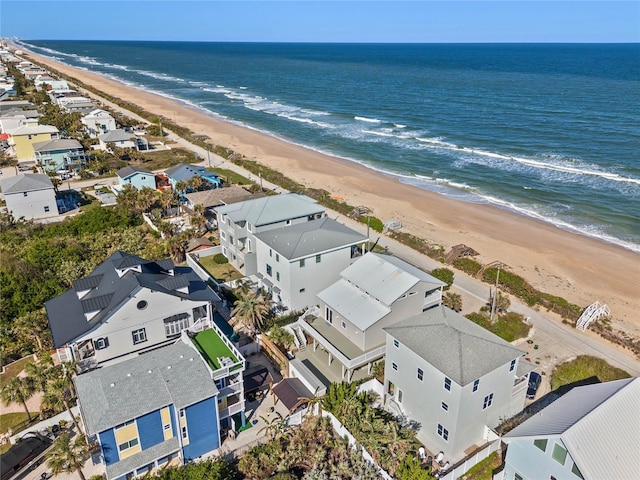 aerial view featuring a water view and a beach view