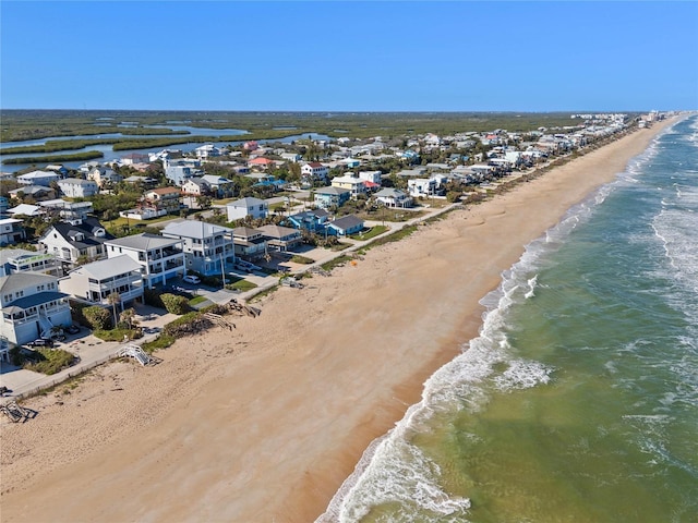 bird's eye view featuring a beach view and a water view