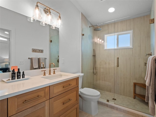 bathroom featuring a shower with door, toilet, tile patterned flooring, and vanity