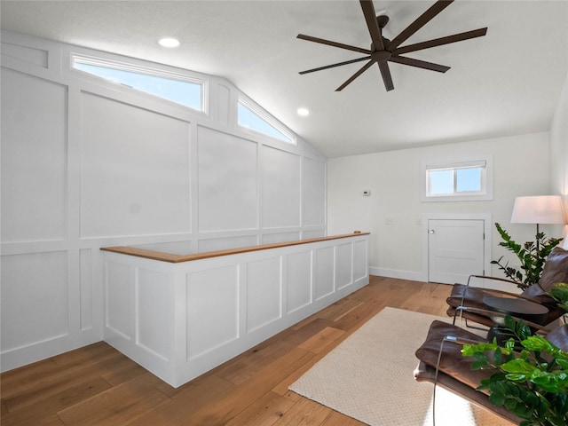 interior space with ceiling fan and lofted ceiling