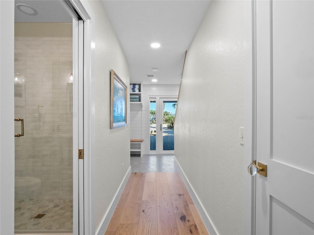 hallway featuring wood-type flooring