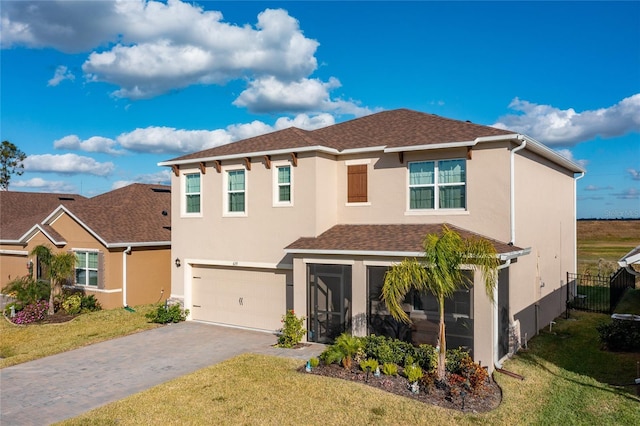 view of front facade featuring a front lawn and a garage