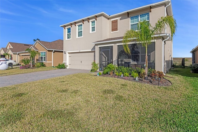 view of front of home with a garage and a front yard