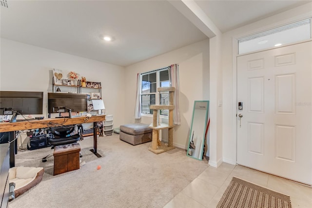 view of carpeted entrance foyer