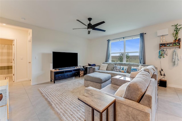 living room with ceiling fan and light tile patterned flooring