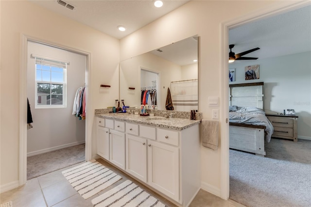 bathroom featuring tile patterned flooring, ceiling fan, and vanity