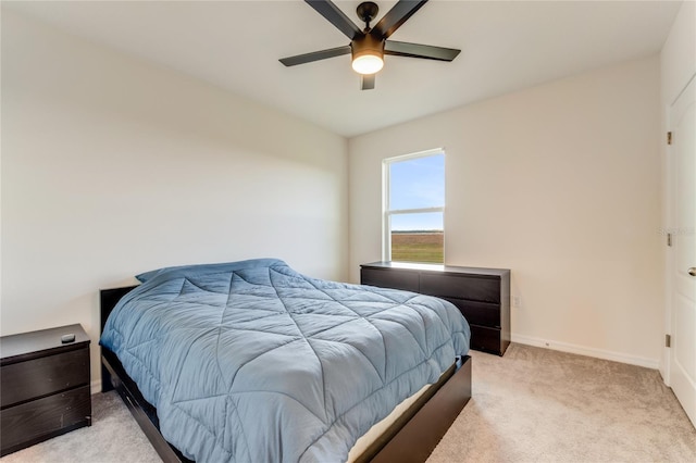 bedroom featuring ceiling fan and light colored carpet