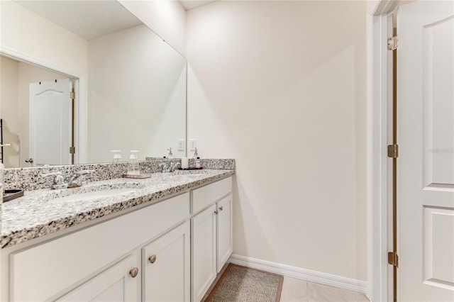 bathroom featuring tile patterned floors and vanity