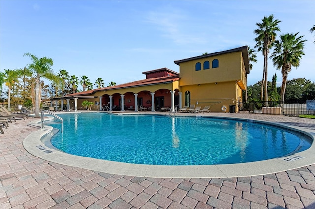 view of swimming pool with a patio area