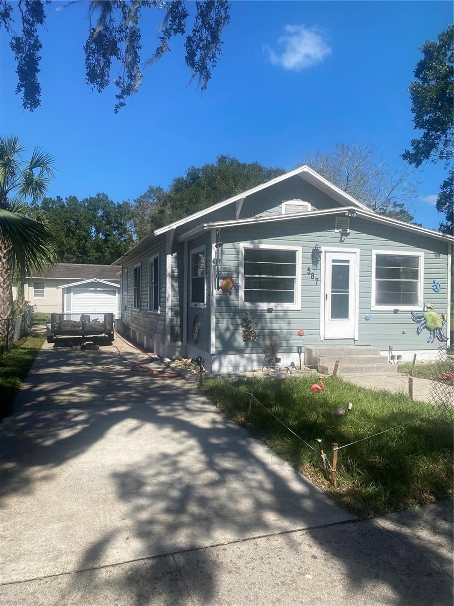 view of front of home featuring an outdoor structure and a garage