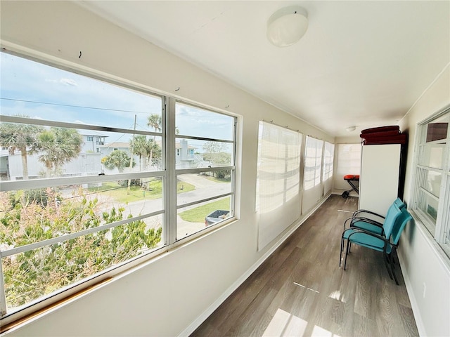 824 Garfish Ave, New Smyrna Beach, FL 32169 - unfurnished sunroom featuring baseboards and wood finished floors
