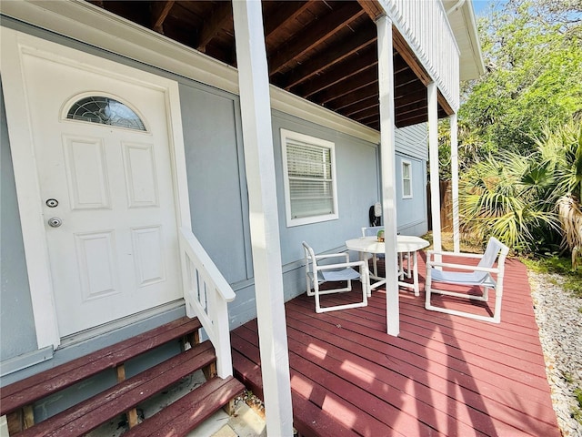 824 Garfish Ave, New Smyrna Beach, FL 32169 - wooden deck featuring outdoor dining area
