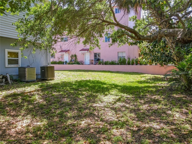 824 Garfish Ave, New Smyrna Beach, FL 32169 - view of grassy yard featuring cooling unit