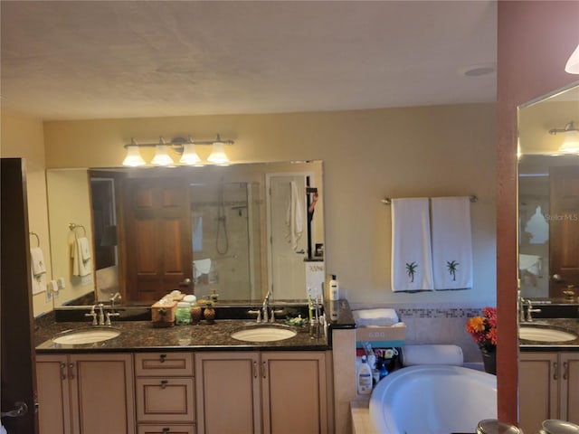 bathroom featuring shower with separate bathtub and vanity