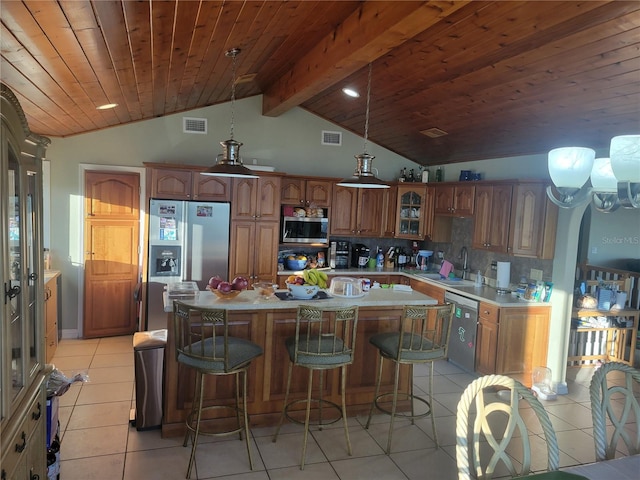 kitchen with decorative backsplash, stainless steel appliances, wooden ceiling, vaulted ceiling with beams, and a kitchen island