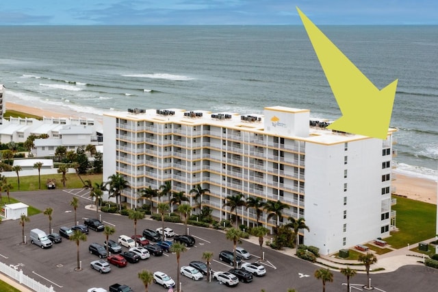 aerial view featuring a water view and a beach view