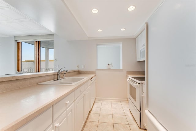 5201 S Atlantic Ave Unit 809A, New Smyrna Beach, FL 32169 - kitchen featuring white appliances, a sink, baseboards, recessed lighting, and light tile patterned floors