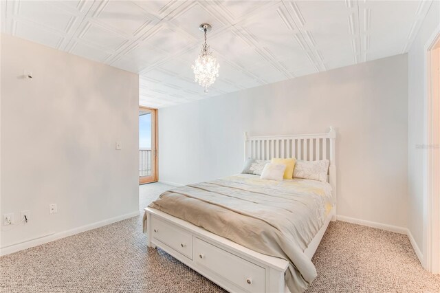 5201 S Atlantic Ave Unit 809A, New Smyrna Beach, FL 32169 - bedroom featuring light colored carpet, baseboards, and an ornate ceiling