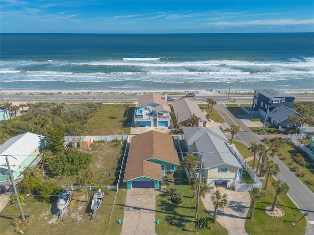 bird's eye view with a water view and a view of the beach