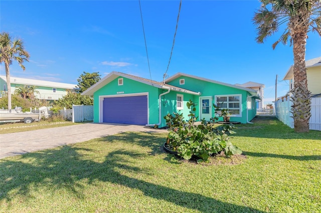 view of front of house with a front lawn and a garage