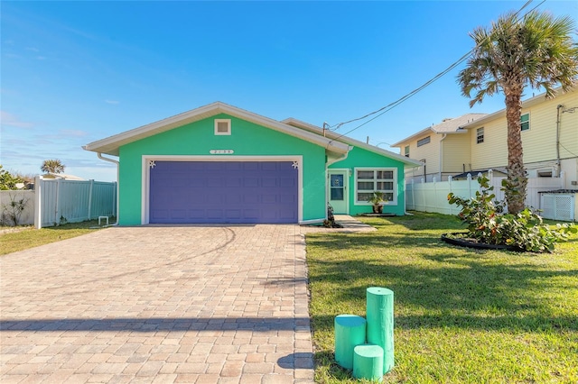 view of front of home featuring a garage, central air condition unit, and a front lawn