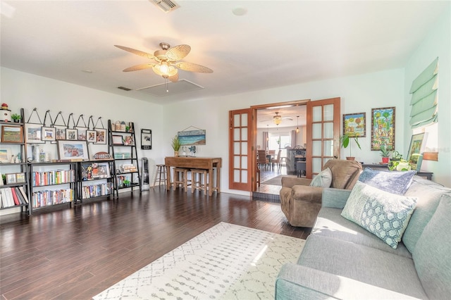 living room with dark wood-type flooring and french doors