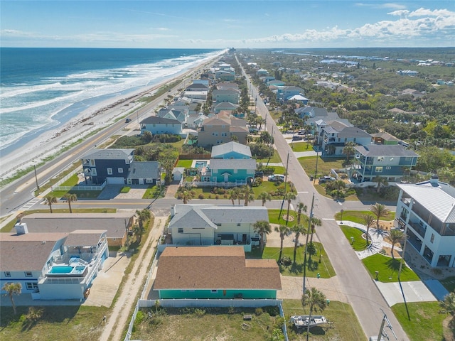 aerial view featuring a water view and a beach view