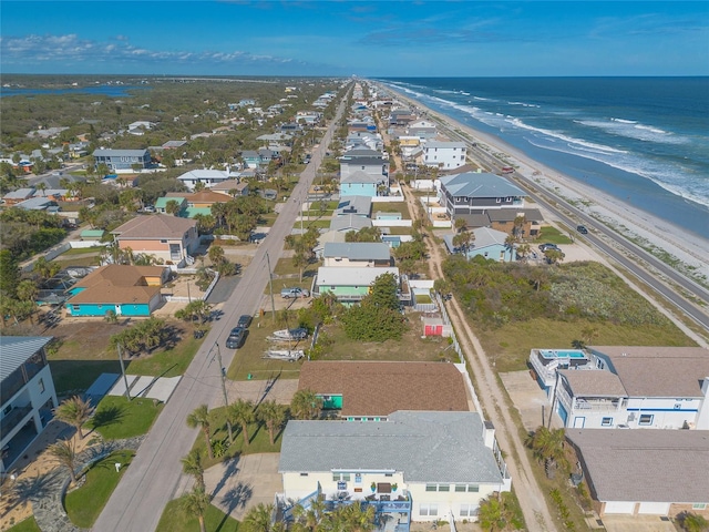 aerial view featuring a water view and a beach view