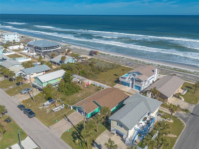 aerial view featuring a water view and a beach view