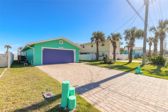 view of front of house with a garage and a front yard